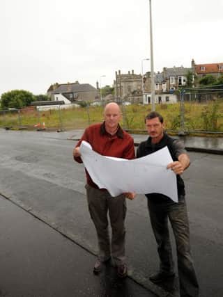 Alan McIlravie and Roy Mackie survey the plans. Pic by FPA