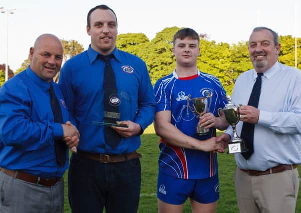 Michael Harper (second left) is presented with last seasons Fife Trophy Centre Star Check award by newly-elected club president Jimmy Bonner (left), while outgoing president Derek Harper (right) presents Player of the Year Rhys Bonner with his trophy.