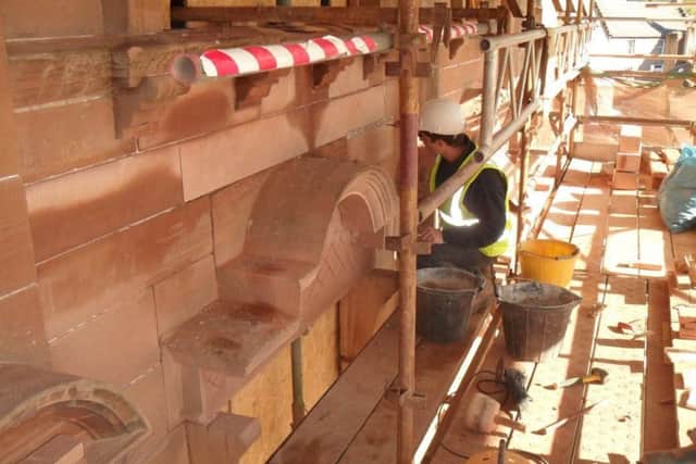 Stonework repair being carried out on the Murray Library