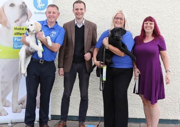 From left, Danny Rooney with his guide dog puppy Gulliver; Stephen Gethins MP; Community Fundraiser Anne Rowse with guide dog puppy Kevin; and Lee Stewart. (Picture: Tony Linney)