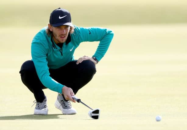 Tommy Fleetwood of England lines up a putt on the fourth green during the final round of the Alfred Dunhill Links Championship at The Old Course in 2016.  Photo by Ian Walton/Getty Images