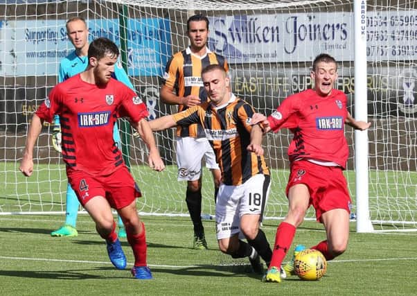 Scott Linton helps to bundle the ball clear for the Methil men at the weekend. Picture by Dave Scott.