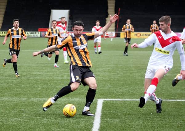 Chris Duggan aims to get a shot away for East Fife, as Airdrie's David Brownlie bears down on him (picture by Jim Corstorphine)