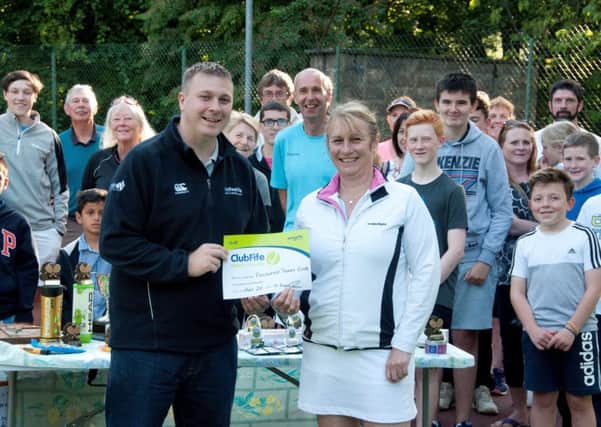 Certificate presentation by Michael Kavanagh, sports development officer with Fife Council, to Liz McCubbin of Falkland Tennis Club.