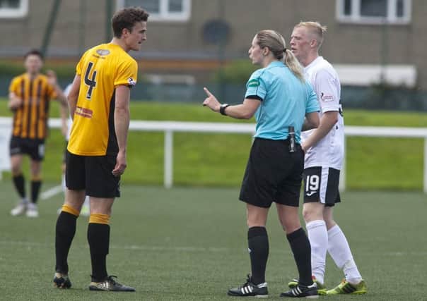 Lorraine Watson lectures a Berwick player during her debut in the senior men's game. Pic: Alistair Linford
