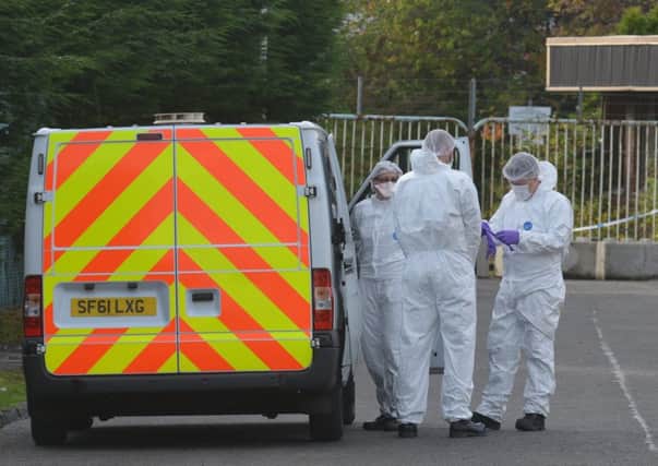 Officers at the scene following the discovery of a body in Kirkcaldy (Pic: George McLuskie)