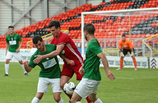 Daniel Sanchez (left, in green) of Tayport, helped pull the local club level.