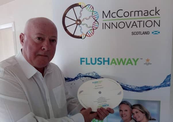 Brian McCormack with the flushaway device.