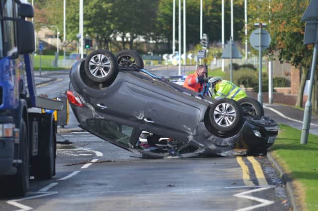 Police attend a car that has flipped on its roof on South parks road Glenrothes.2 Oct 17