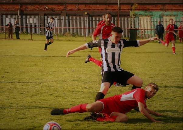 Christie of Newburgh is tackled by David Gray of Kinnoull.