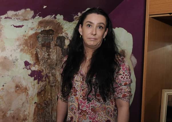 Sammy McFarlane has had water running down the wall into her council house. Picture: George McLusky