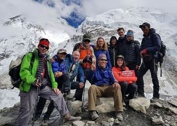 Ellen, with the dark hair at the back of the group, at Everest Base Camp.
