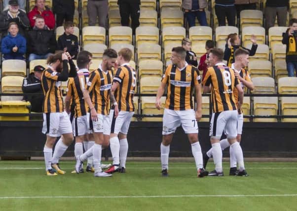 The Methil men celebrate with their fans after Chris Duggans second goal on Saturday. Picture by Andrew Elder.