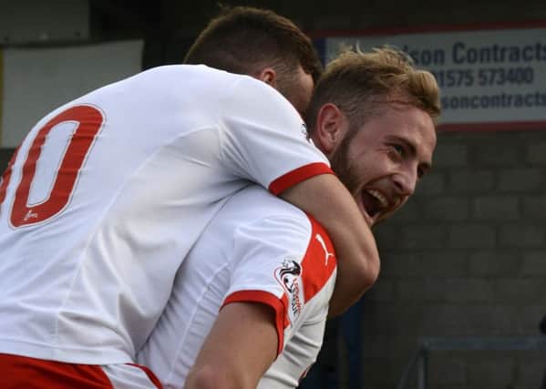 John Herron celebrates his first goal for Raith Rovers along with Lewis Vaughan. Pic: Eddie Doig