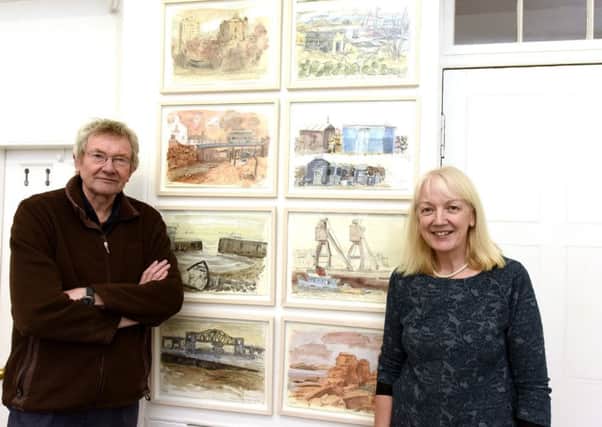Lynette Gray and her husband, Douglas with paintings from their new exhibition. Pic credit:  Fife Photo Agency