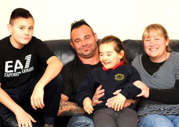 Jennifer Newlands with her six year old daughter Amelia - and son Josh, age 13 and dad Kris. Pic  credit: Fife Photo Agency