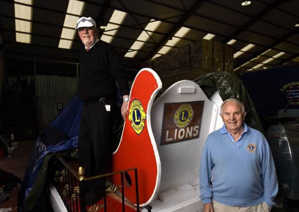 Lions president George MacDonald and Jack Christie give a sneak peak at the sleigh. Picture: Fife Photo agency