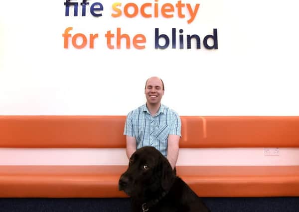 Stuart Beveridge with his guide dog Ron at Fife Society for the Blind. Pic: Fife Photo Agency
