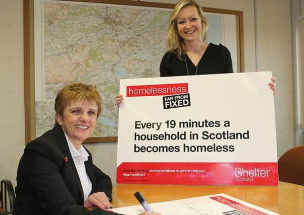 Cllr Judy Hamilton signs-up to Far From Fixed with Fiona King, campaigns manager at Shelter Scotland.