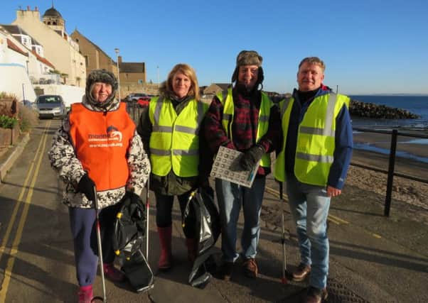 Kirkcaldy MSP David Torrance helps Kinghorn beach volunteers on their litter pick
