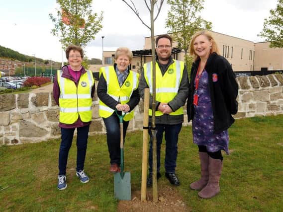 Scott planting rowan trees outside Burntisland Primary School, with Margaret Green, Mary Kay and Julie Anderson, head teacher. Pic by FPA