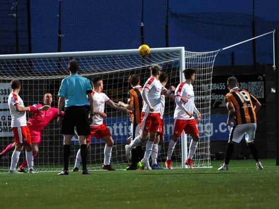 Scott Linton (18) watches on as his free-kick beats Graeme Smith. Pic by Walter Neilson.