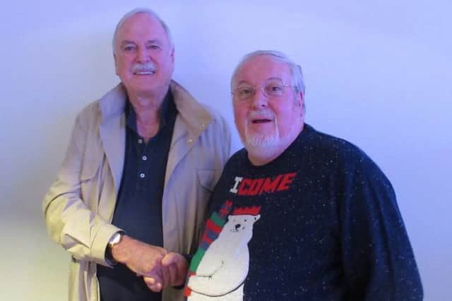 Ritchie Wilson with John Cleese.