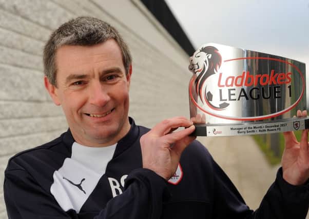 Raith boss Barry Smith with his Ladbrokes League One Manager of the Month award for December -  credit- WALTER NEILSON