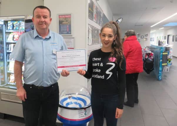 Chiara Alagia from CHSS (right) receiving the fantastic donation from Neil Martin (left) at Michael Woods Leisure Centre.