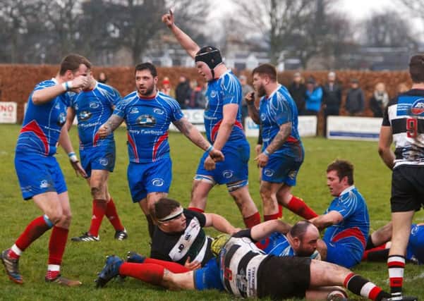 Kirkcaldy players celebrate as Greg Wallace grounds the ball for a try. Pic: Michael Booth.