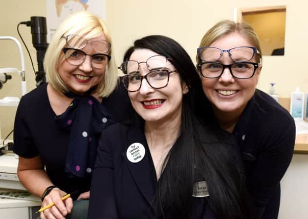 Gil Pilon, Mairaid Hamilton and Pamela Stewart from Specsavers in Kirkcaldy with some of the donated specs. Pic  credit: Fife Photo Agency