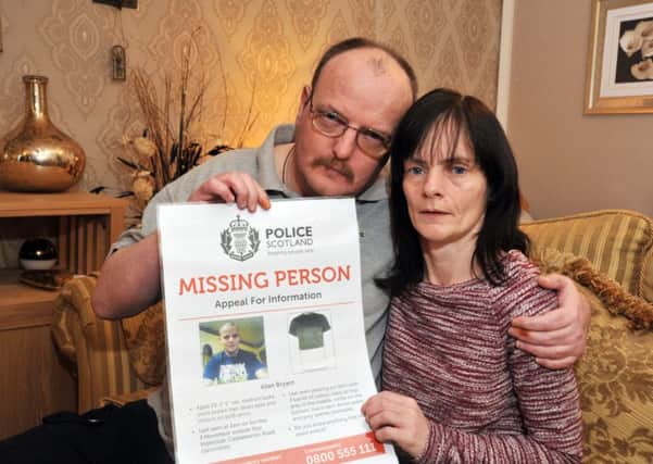 Allan's parents Allan Snr and  Marie Degan at their home with the inital police poster issued soon after their son's disappearance.