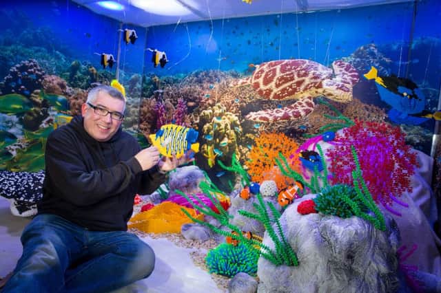 Warren Elsmore with the model of the Great Barrier Reef.