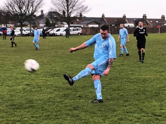 Aaron Leadbetter launches a ball forward for Cupar Hearts.