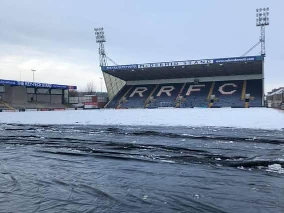 The snow-blanketed covers will be removed from the Stark's Park pitch this afternoon. Pic: Twitter/@Raith Rovers_FC