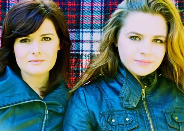 Celtic folk sister duo Cassie and Maggie MacDonald,  from Nova Scotia.