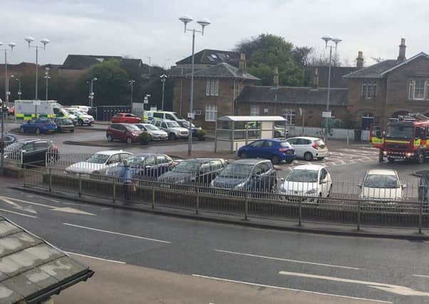 Police, ambulance and fire service staff at Cupar train station. Picture: Maureen Ferrier