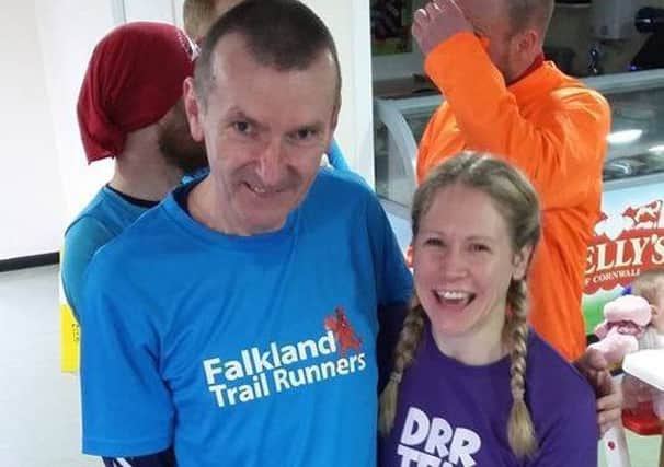 Brian Cruickshank with club mate Hailey Marshall to commemorate him running his 250th parkrun