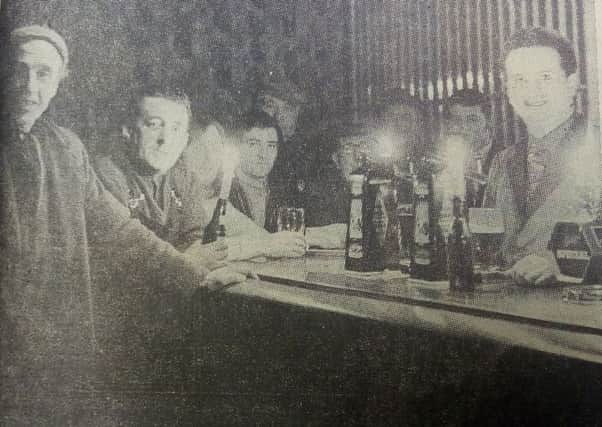 Kirkcaldy 1972 miners strike - drinking by candlelight at the Novar Bar during a power cut