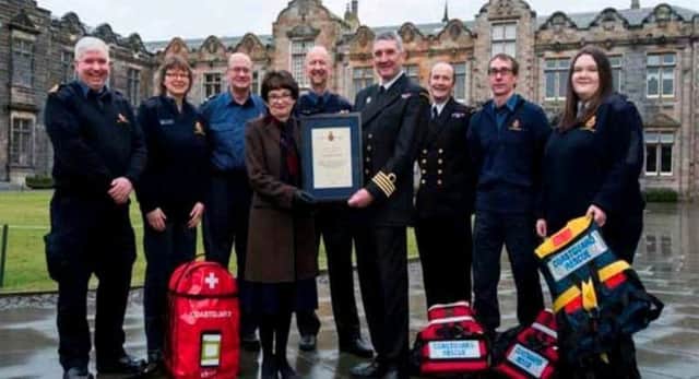 Volunteer Coastguards at St Andrews University have been honoured for their bravery and service by senior figures from Her Majestys Coastguard.