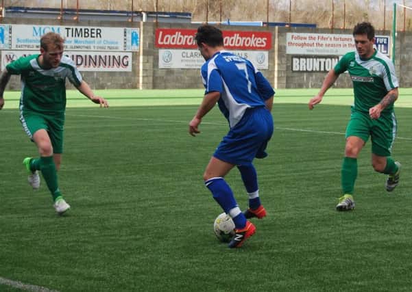 Craig Donaldson takes on Ben Anthony and Sam Buchan in Thornton Hibs' friendly defeat to Camelon