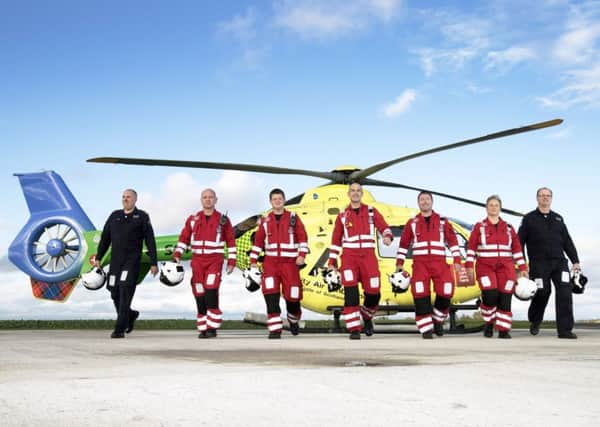 Scotland Chairty Air Ambulance (SCAA) team pictured from left, Captain Nigel Clarke, Paramedic John Salmond, Paramedic Graeme Hay, Lead Paramedic John Pritchard, Paramedic Craig McDonald, Paramdic Julia Barnes and Captain Russell Myles
Picture by Graeme Hart.
Copyright Perthshire Picture Agency