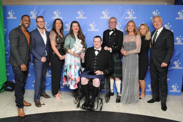 Members of the Bishopton-based Bravehound project with their 2017 National Lottery Award for Best Voluntary/Charity project with celebrities; Richard Blackwood, JJ Chalmers, Tamzin Outhwaite, Kimberley Walsh and Martin Kemp at last years National Lottery Awards ceremony.