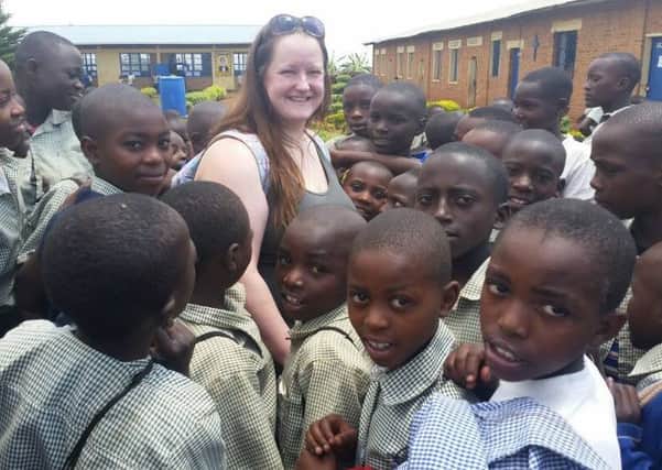 Suzie Mahr with youngsters in Rwanda.