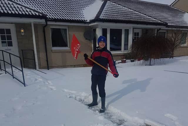 Kieran (10), clearing paths so carers can reach sheltered housing