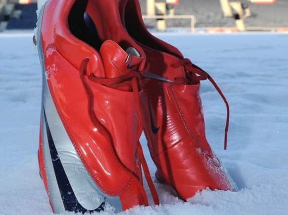 Football boots in the snow. Pic: Neil Doig