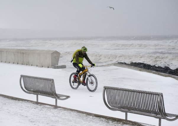 A brave cyclist takes a trip along the Prom in Kirkcaldy (Pic: George McLuskie)