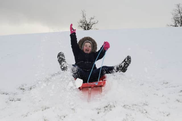 Kayla Wilson (8) enjoys the snow. Pic by George McLuskie
