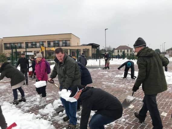 Volunteers clearing Burntisland Primary School of snow