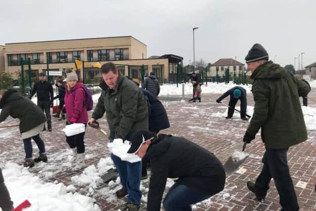 Snow clearing by volunteers has helped schools to re-open